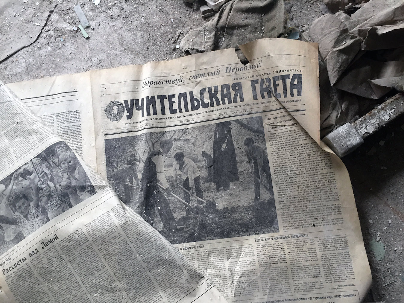 An old newspaper on the floor.